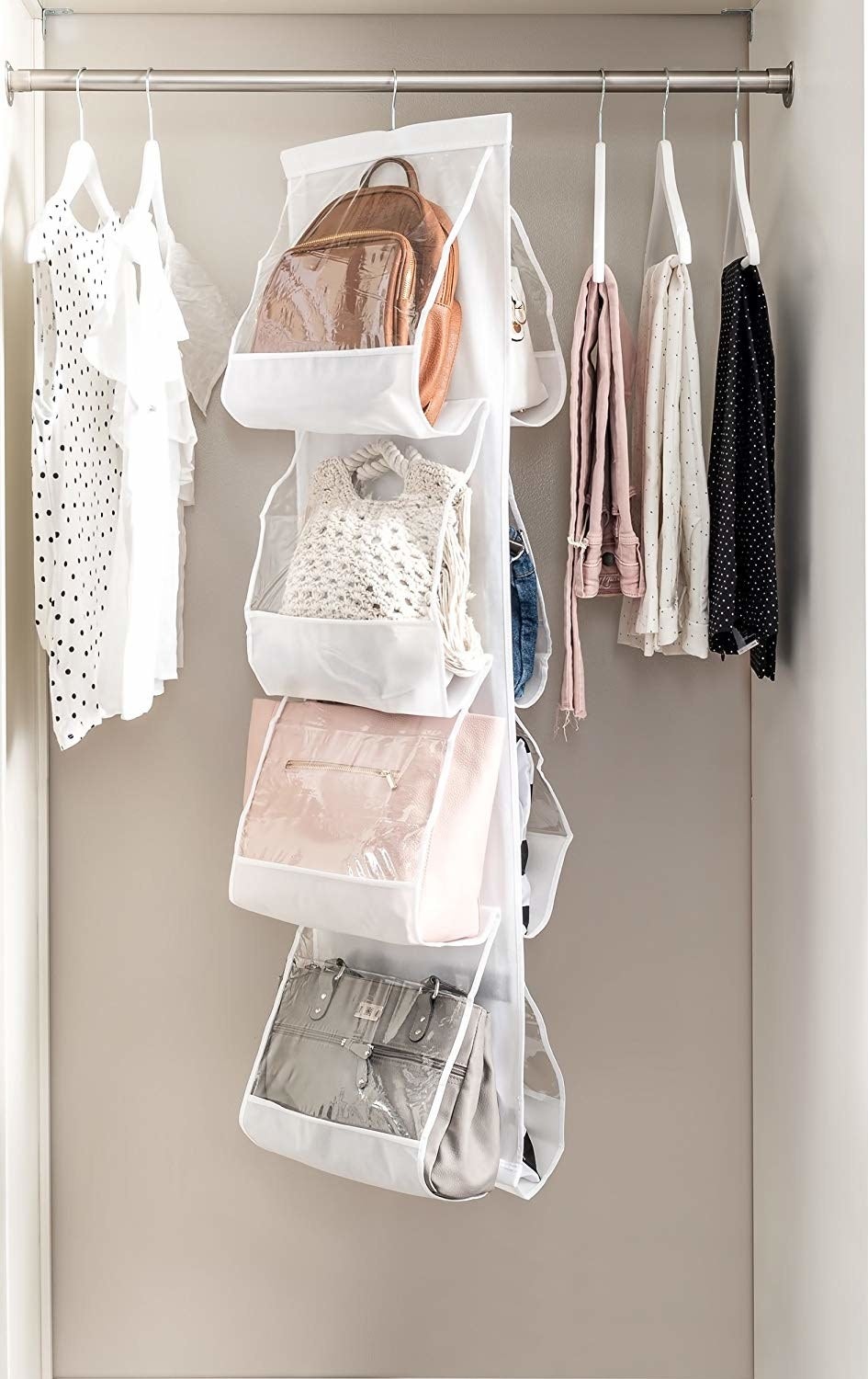 vertical purse organizer hanging in the closet