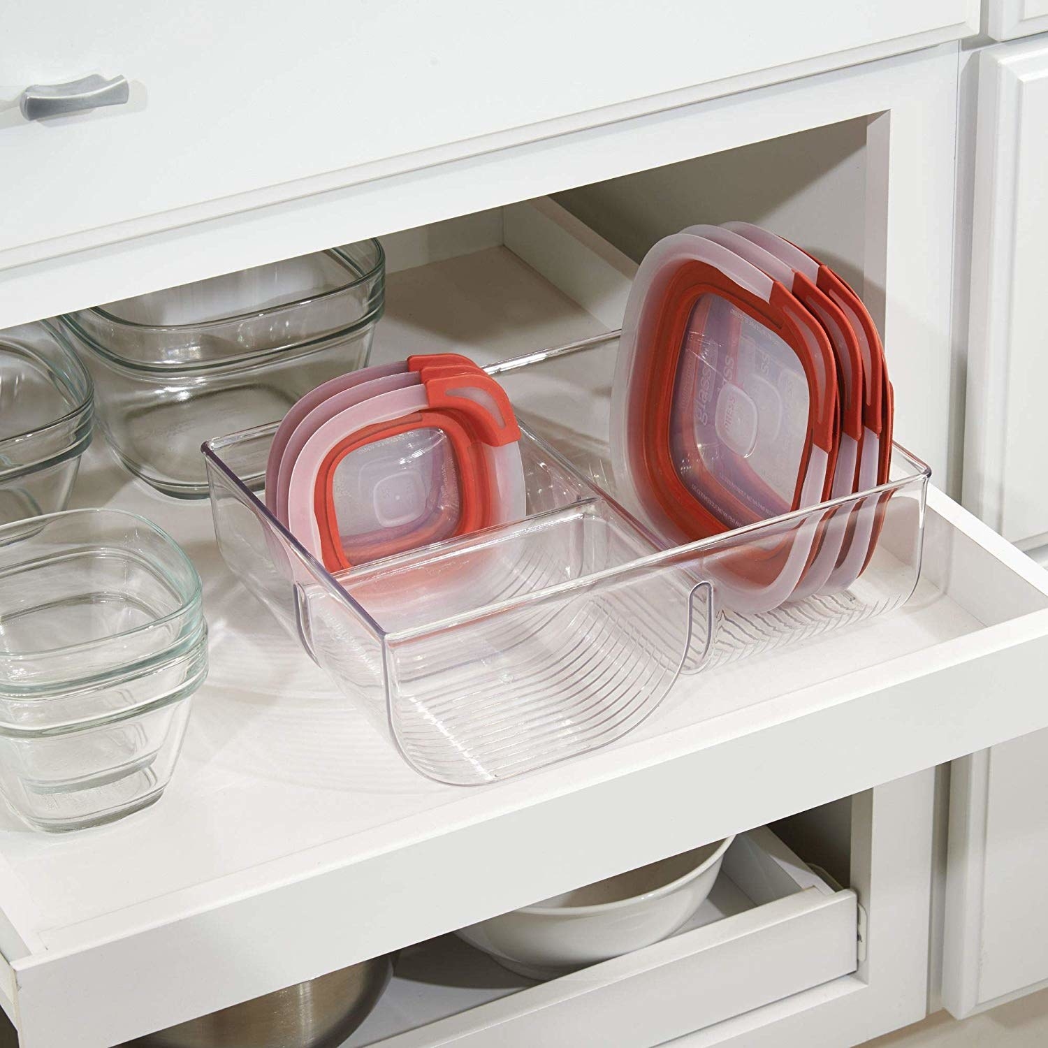 open kitchen storage drawer with visible food storage containers and the featured translucent organizer with notched slots to help file the storage lids