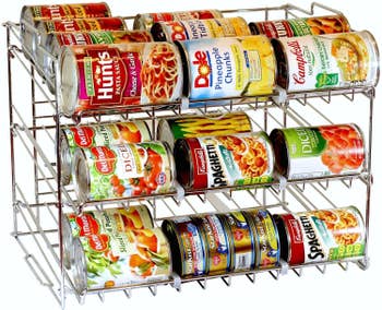 vertical metal rack with three rows designed to hold cans that roll to the front when one can is taken out