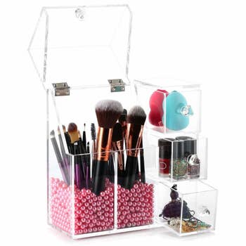 clear organizer with beads in it to keep makeup brushes upright