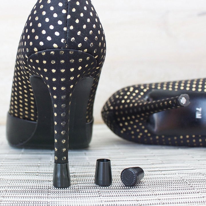 the black heel caps on a pair of pumps