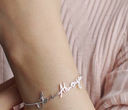 Bracelet with handwritten words that say 