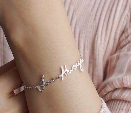 Bracelet with handwritten words that say 