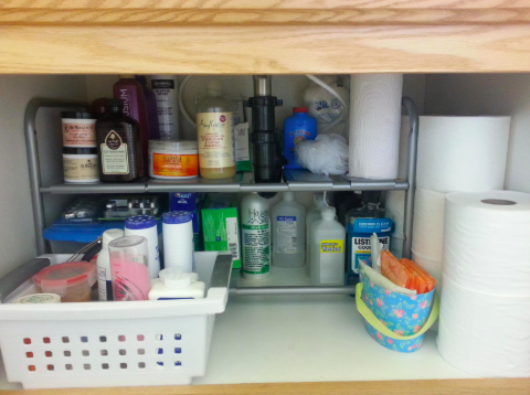 reviewer pic of customizable organizer underneath bathroom sink 