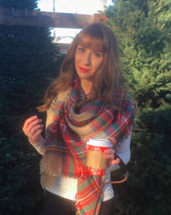 reviewer wears plaid scarf 
