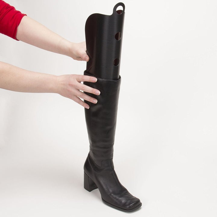 a model placing the inserts inside a boot