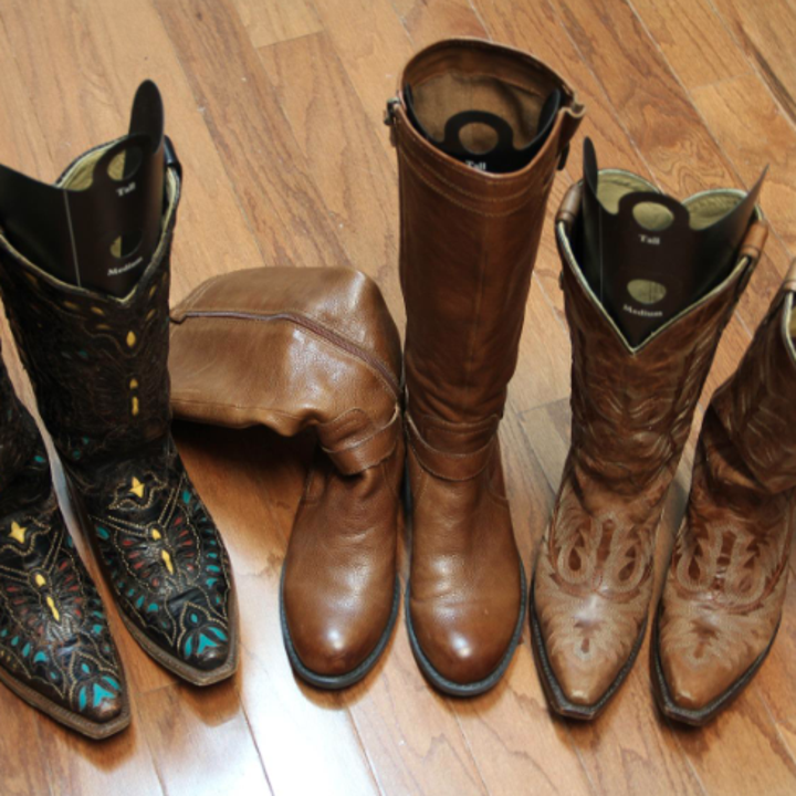 a reviewer's photo of boots without inserts flopping over and boots with inserts standing up 