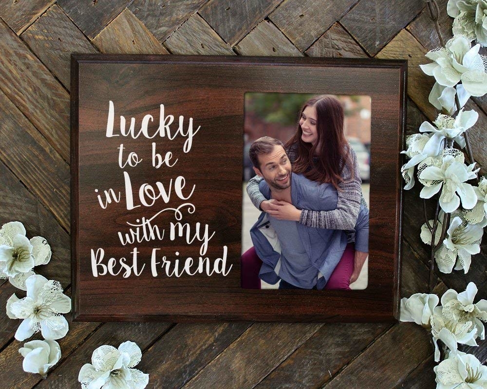 Dark wood frame with the words &quot;Lucky to be in Love with my Best Friend&quot; beside a photo 