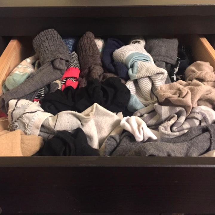 Reviewer's "before" picture of a messy sock drawer 