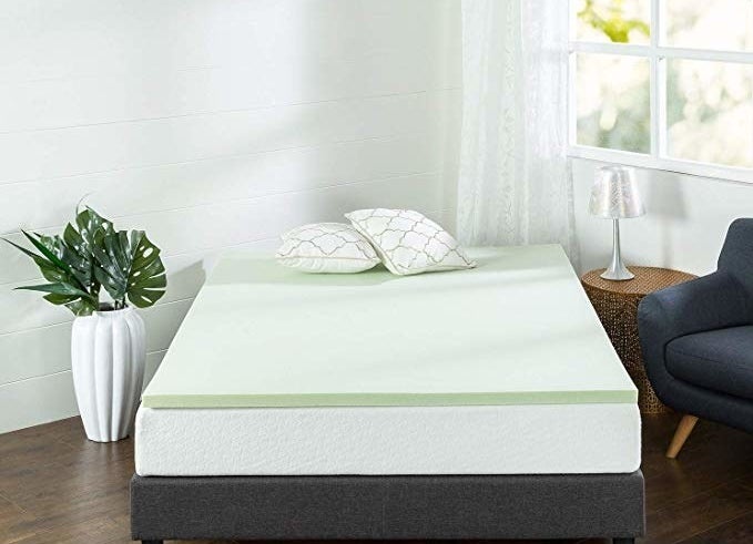The light green topper on a mattress