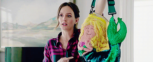 Angie with the dreaded mermaid purse on Single Parents.