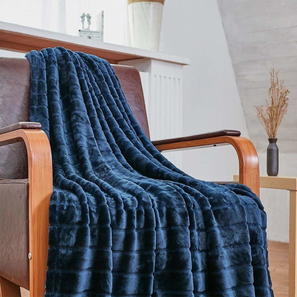 And it's machine-washable!Promising review: "This is the second one of these blankets that I bought. It is literally the softest, fluffiest blanket ever. I love it. 11/10, would recommend any day. I'm probably going to get a bunch of these as Christmas presents." —RUKie CookieGet it from Amazon for $14.81+ (available in sizes throw-king and six colors).