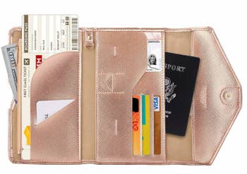 The rose-gold wallet open to show everything it can hold