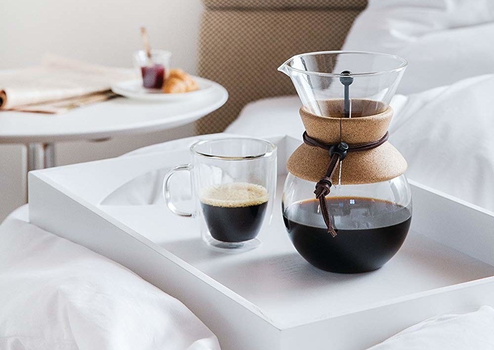 The glass coffee maker with cork around the middle