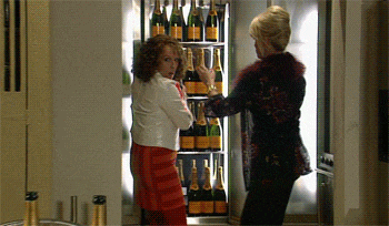 Edina and Patsy from Ab Fab getting champagne out of a fridge