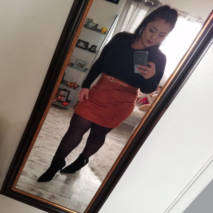 reviewer wearing it with a skirt and tights