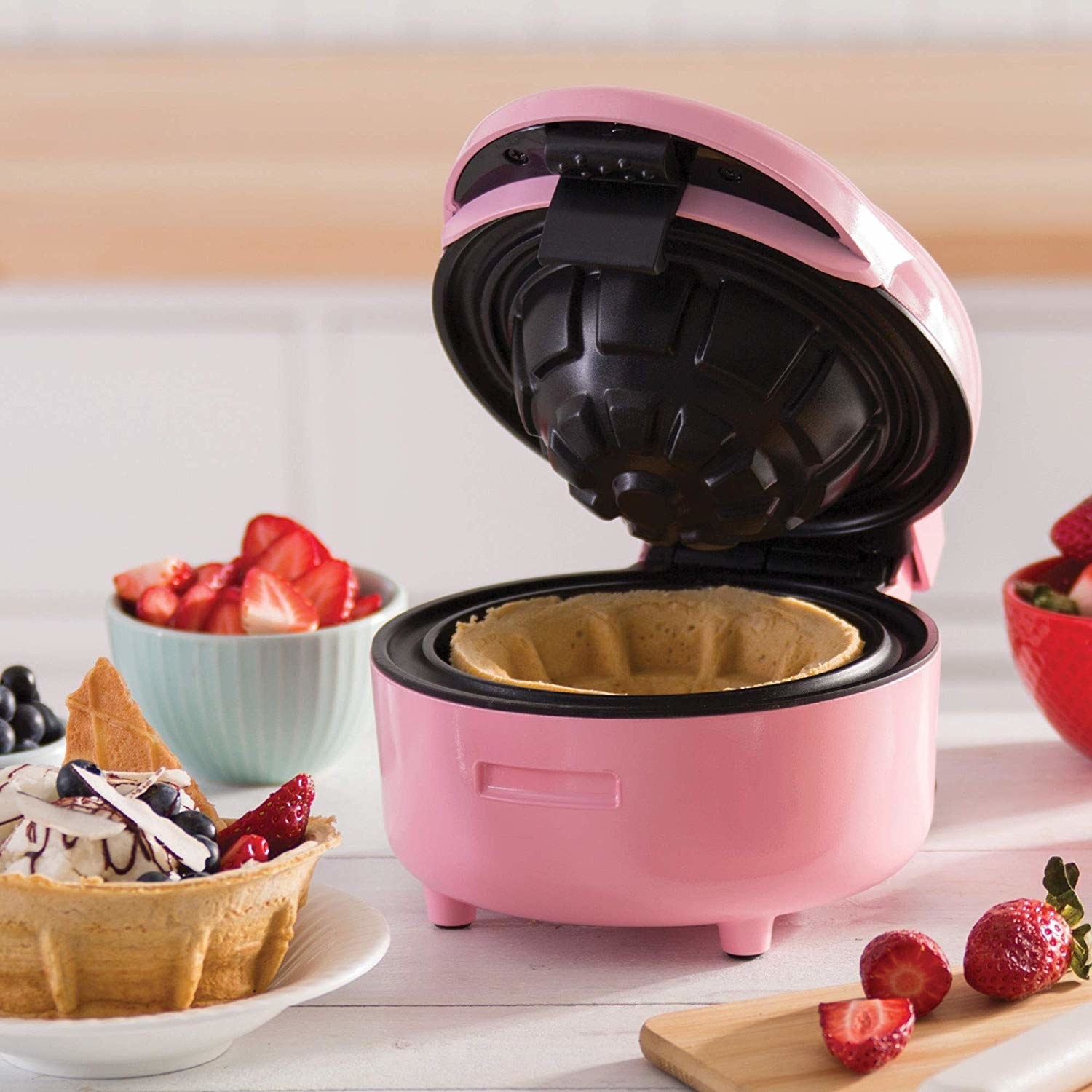 It only weighs three pounds!Promising review: "I am not the biggest breakfast person, but I love this machine. Making a waffle bowl filled with fruit is a great way to start your morning. The color goes great in our kitchen. We have used this guy for quite a few breakfasts now. There are many ways to use this, but so far waffle bowls are my favorite." —Scott BrownGet it from Amazon for $17.99 (available in three colors).