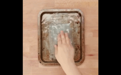 Check out Nifty's full tutorial.Instructions:1. Fill pan with warm water and a dash of dish soap.2. Add a dryer sheet. Let soak for about an hour.3. Rinse, then wipe down with a sponge. The burnt-on food, grease, etc. should be softened and wipe right off!Get dish soap for $5.05 and dryer sheets for $5.70, both from Amazon.