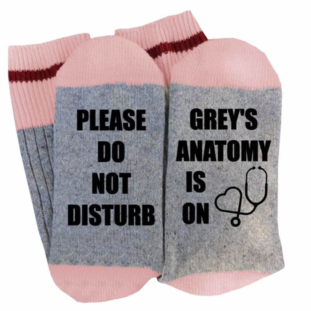 The socks which read, &quot;Please do not disturb, Grey&#x27;s Anatomy is on.&quot; on the soles.