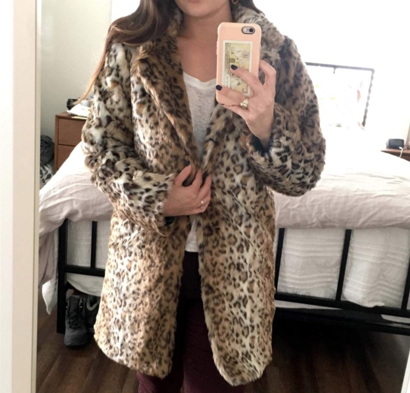reviewer wearing the longer leopard print faux fur coat