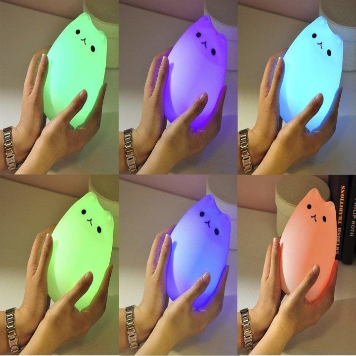 The various colors the cat can turn, including green, blue, purple, and red