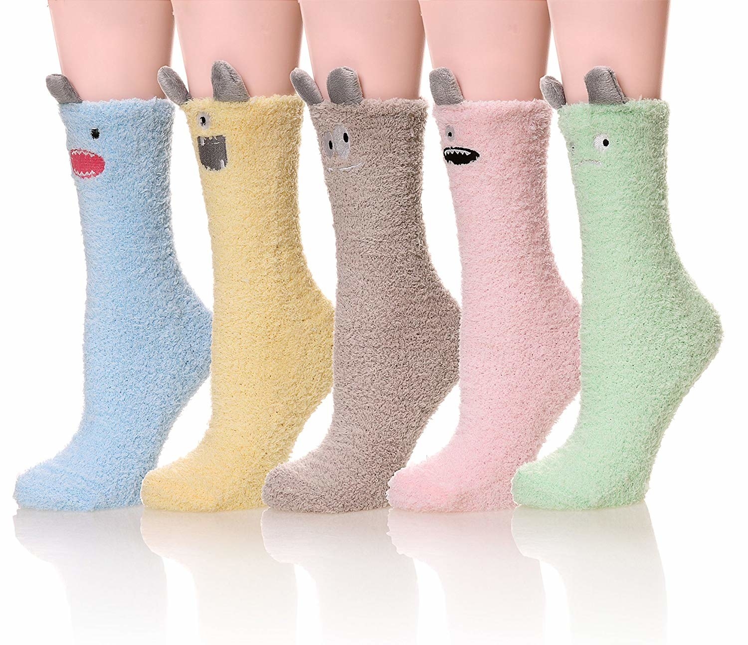 The five pairs of socks in different colors (blue yellow, tan, pink, and green) with ears and different facial expressions
