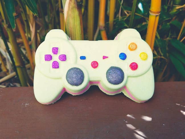 a bath bomb shaped like a video game controller