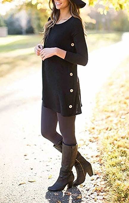 model wearing a tunic with buttons on the sides with tights and knee high boots