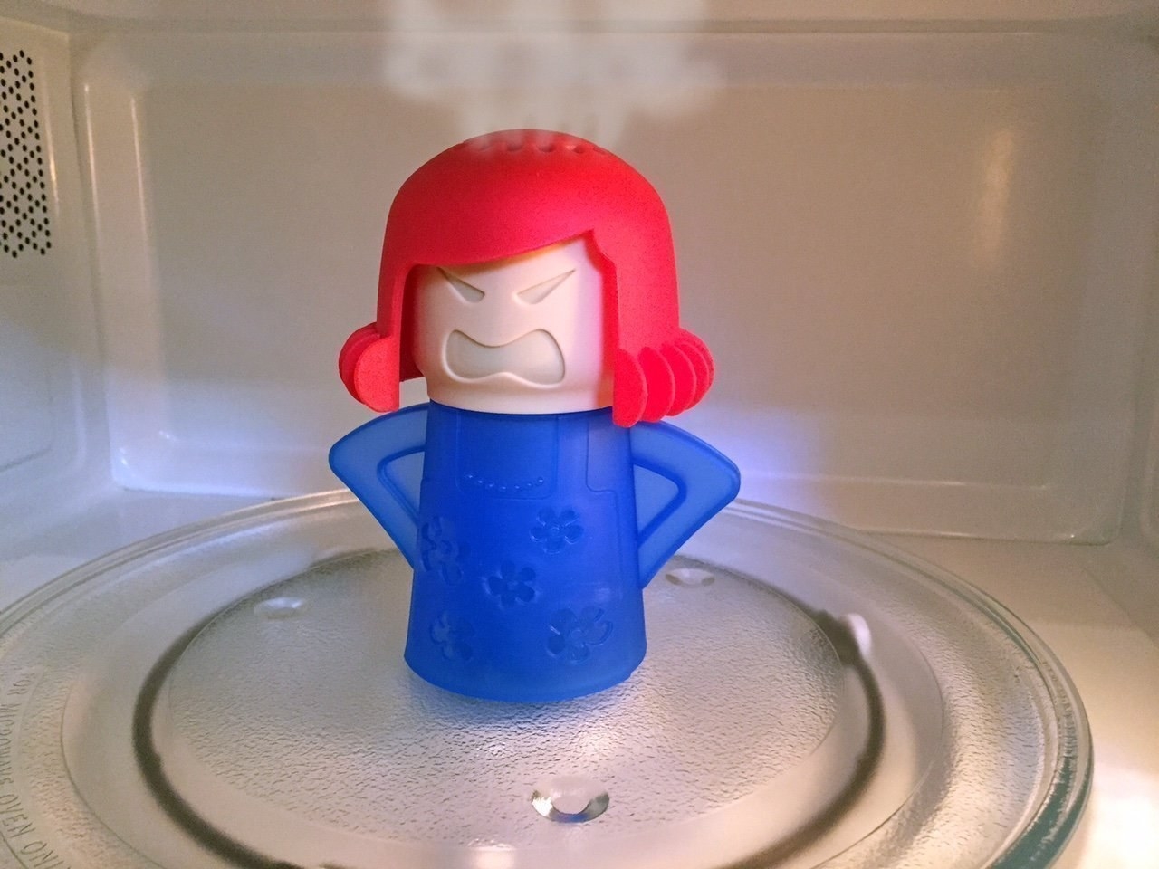 the mom shaped cleaning tool in a microwave