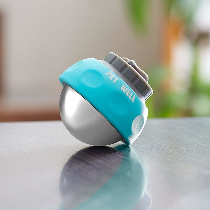 the handheld roller massager in a turquoise blue color