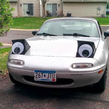 Car with eyes on headlights