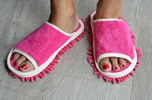 The dusting slippers in pink on feet 