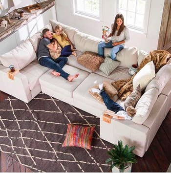 family sitting on a giant couch