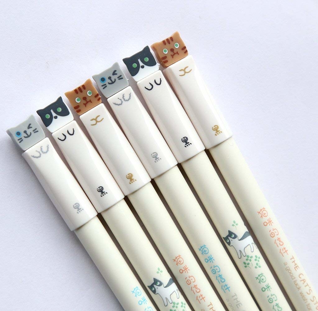 The adorable gel pens with cats on the top of them
