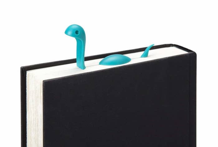 bookmark that looks like loch ness monster swimming in between pages