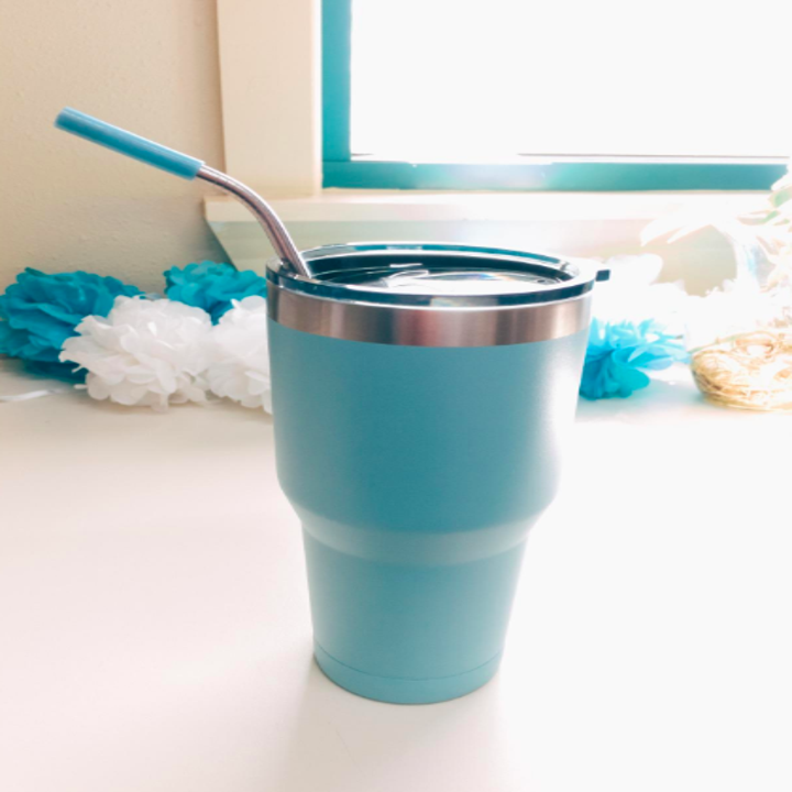 straws inside a travel tumbler cup