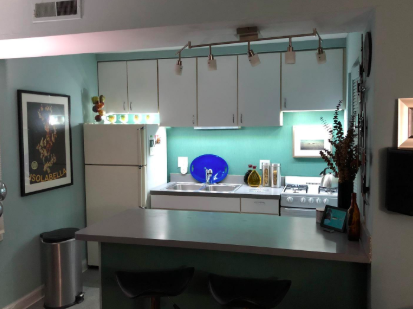 small kitchen with lights under the cabinet for a larger, brighter look
