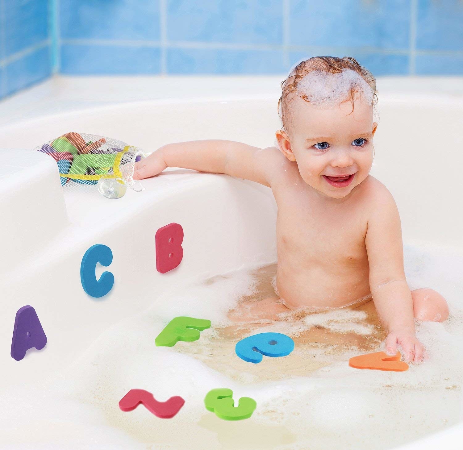 The foam letters in the bath tub with a child