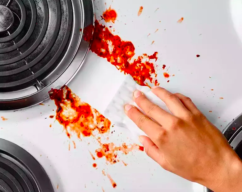 magic eraser removing pasta sauce stains from stovetop 