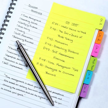 The yellow, orange, pink, green, blue, and purple tabs being used to divide a notebook into study chapters. The one at the front has a list of notes labeled 