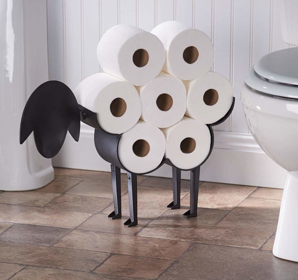 metal sheep holder with seven rolls of toilet paper that look like its wool