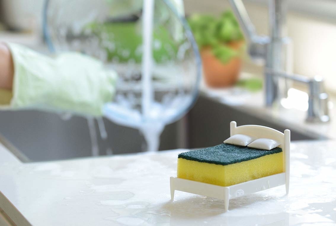 the bed sponge holder next to a sink