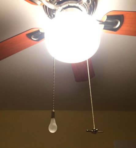 long chains with charms shaped like lightbulb and fan