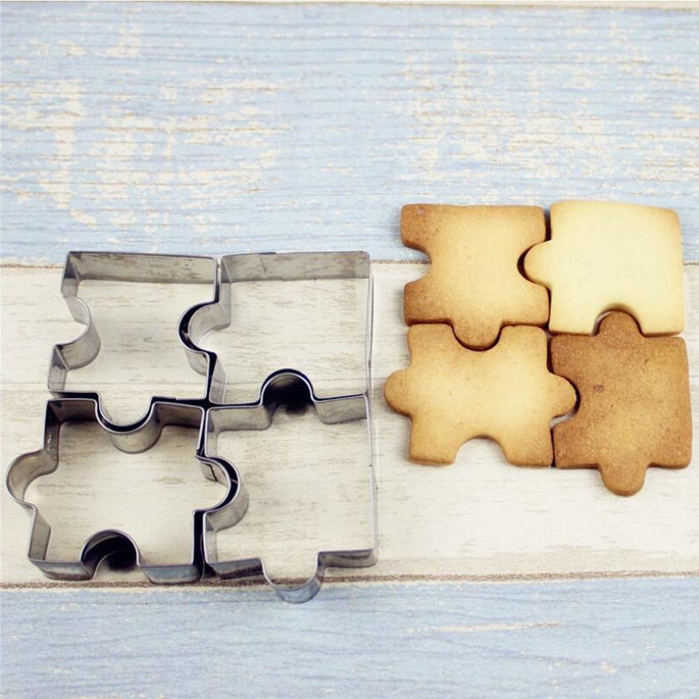 puzzle piece cookie cutters next to puzzle piece cookies