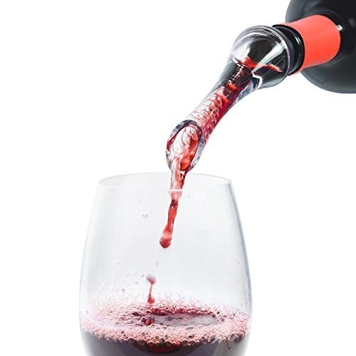 wine being poured through a small wine aerator attached to a wine bottle