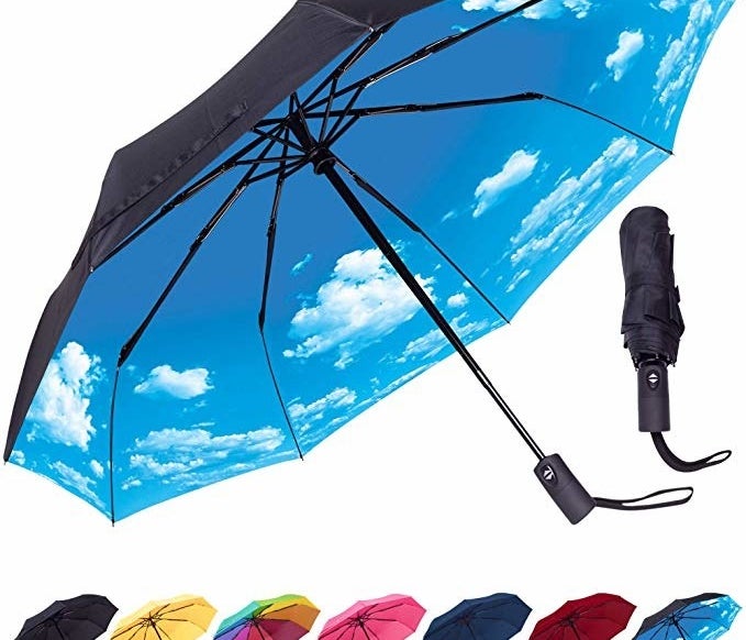 black umbrella with blue sky print on the inside when you open it 