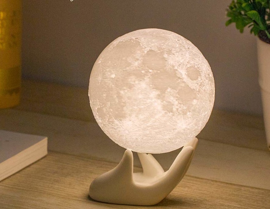 the small globe light that does look like the moon, balanced on the included stand