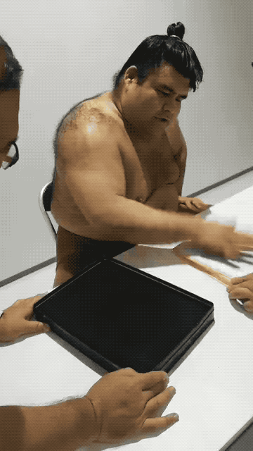 I Can't Stop Watching This Sumo Wrestler Sign Autographs