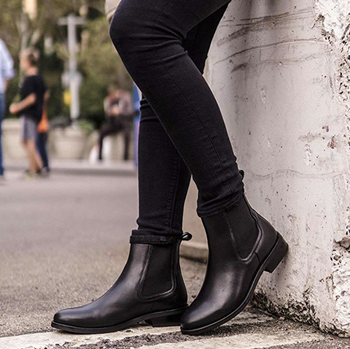 Model is wearing black Chelsea boots