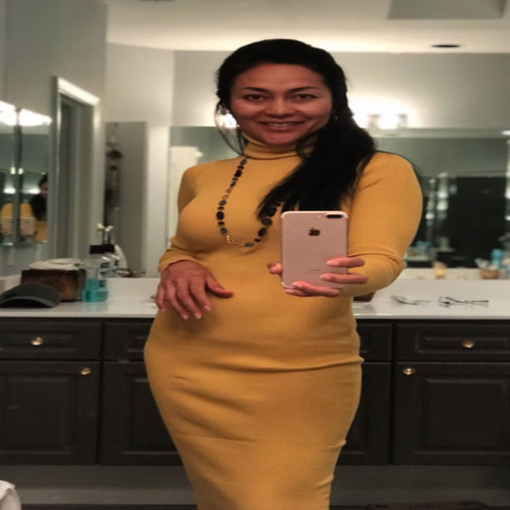 reviewer wearing the yellow dress